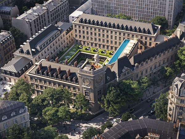 A striking aerial perspective of The Maybourne Saint-Germain, showcasing its historic architecture, lush courtyard gardens, and an exquisite rooftop pool, nestled within the heart of Paris.